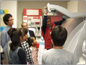 Children receiving an explanation of an ATM
